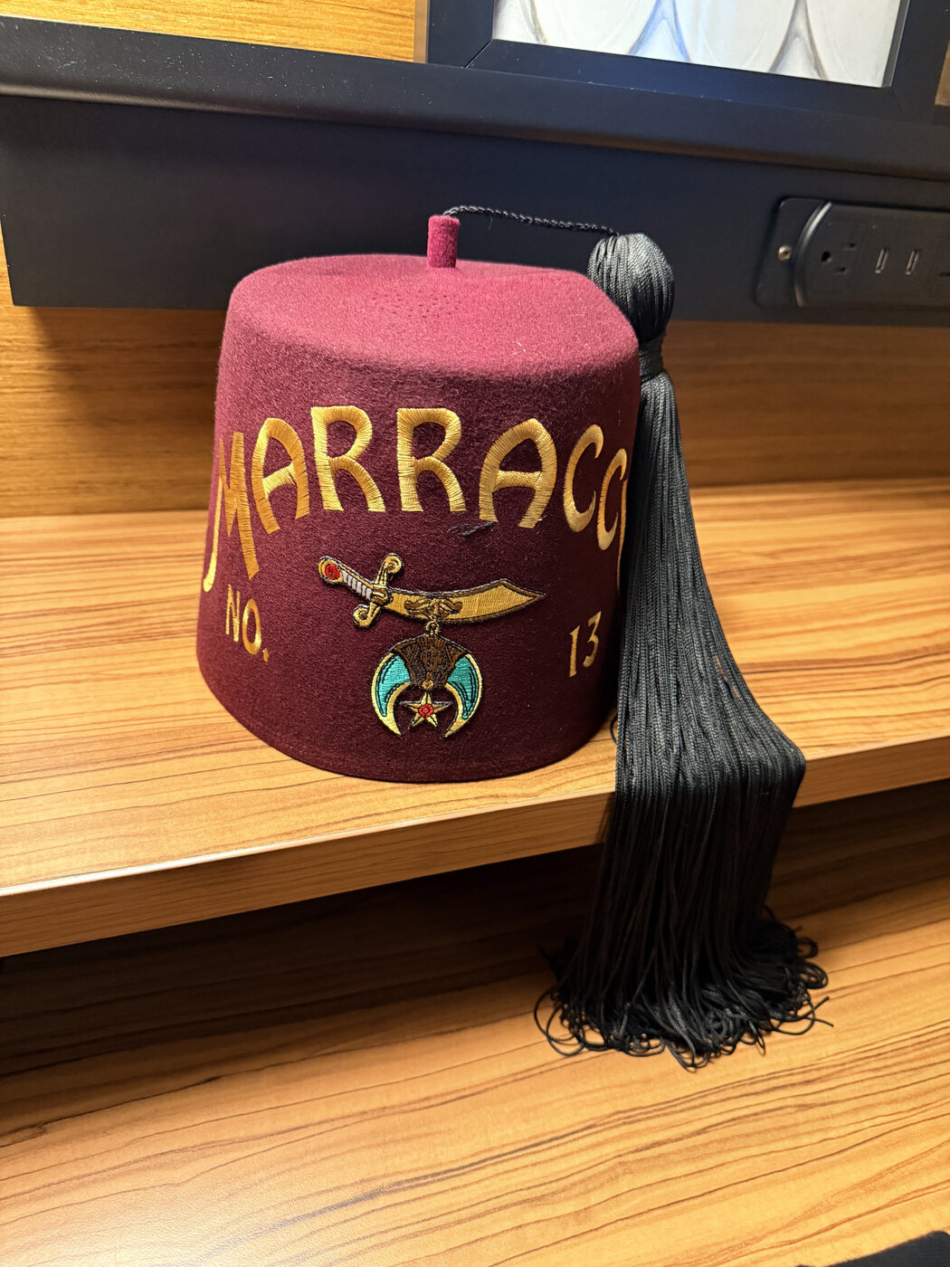 The ceremonial fez of Marracci No. 13, embroidered in gold with the Shriners emblem